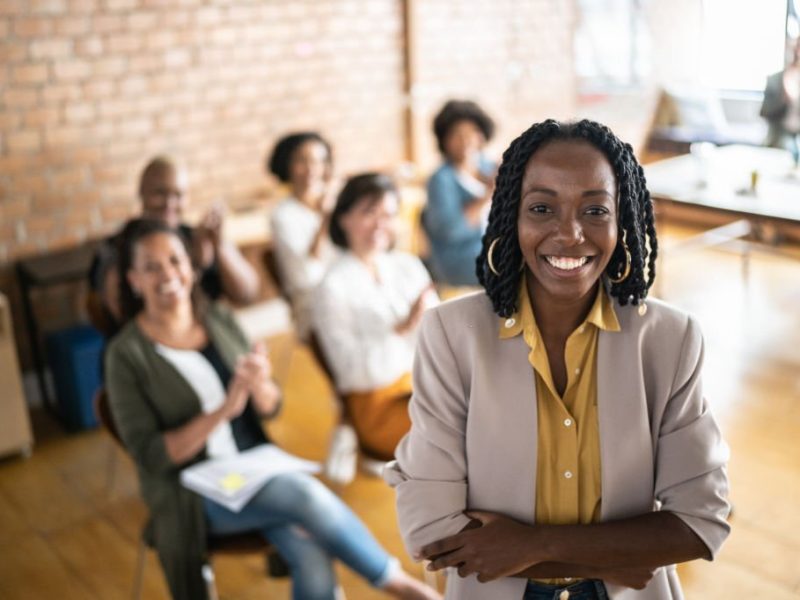 Portrait of businesswoman delivering a speech during a conference